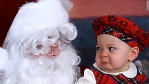 Santa claus with crying baby