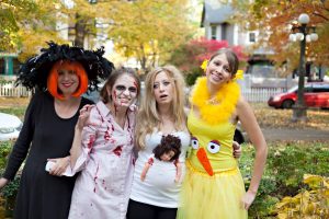 Witch, zombie, pregnant, and big bird costumes for Halloween