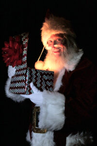 Santa Claus holding a gift